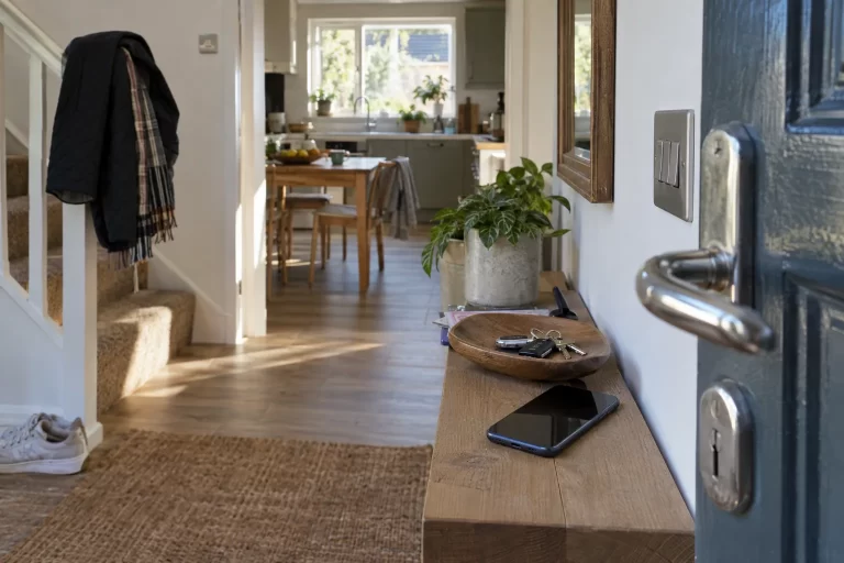 Home entrance and kitchen showing frequently used doors and surfaces